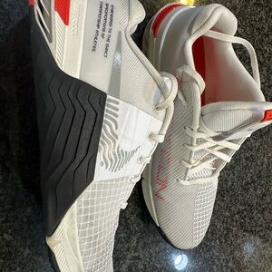 Nike White and Black Athletic Shoes with Red Accents